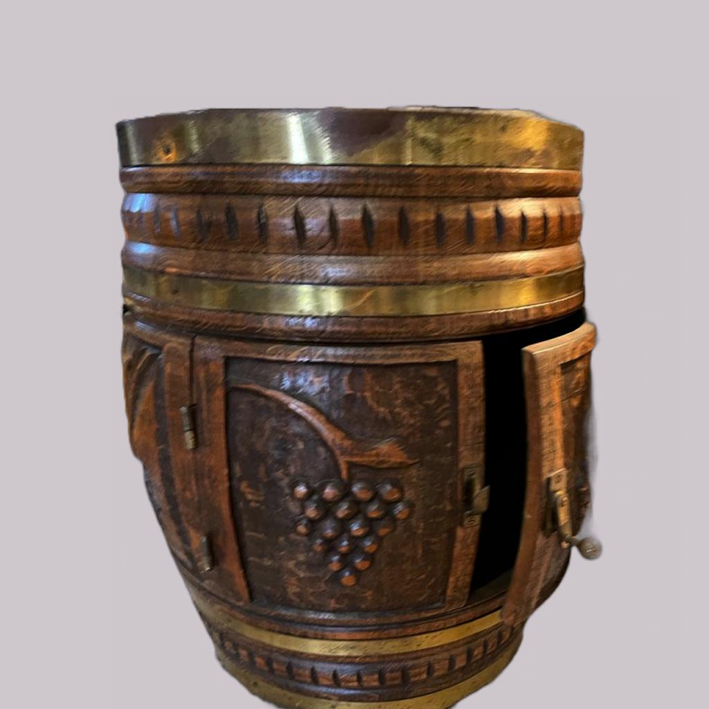 Carved Oak and Brass Barrel Wine Cabinet